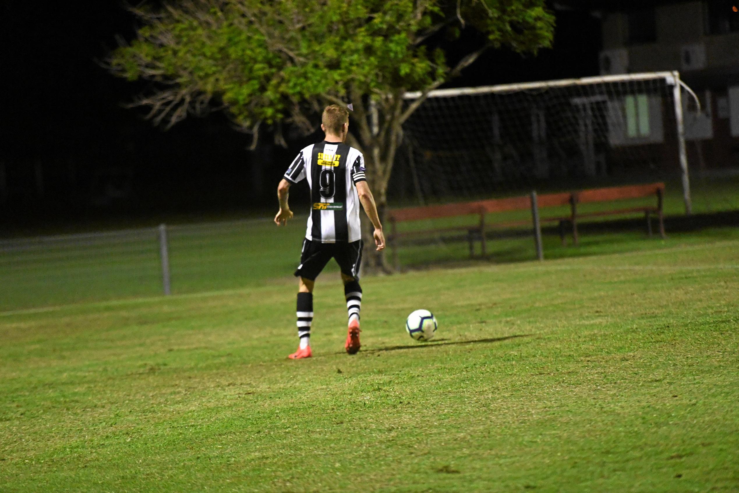 Bingera's Daniel Watson with the ball as he prepares to cross it. Picture: Shane Jones