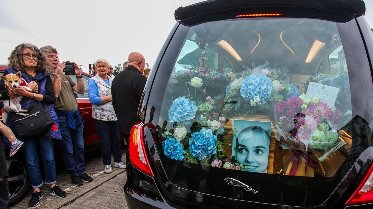 Thousands lined the streets to watch the funeral procession take O’Connor from a memorial service, attended by Bono and Bob Geldof, to a private burial. Picture: AFP