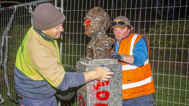 Council workers clean up defaced statue of John Howard. Picture: Rob Leeson.