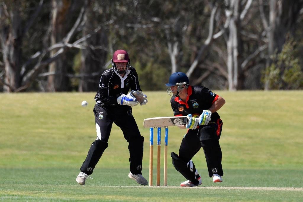 George Banks Umbrellas keeper Chris Hall (left) and Darren Koch of Liebke Lions in Darling Downs Bush Bash League (DDBBL) round five T20 cricket at Highfields Sport Park, Sunday, October 20, 2019. Picture: Kevin Farmer