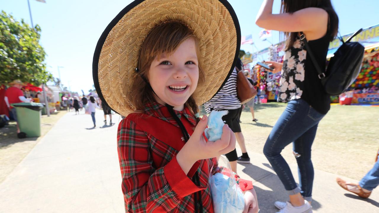 Nellia Krasnova enjoys some fairy floss at the Gold Coast Show. Picture: Mike Batterham