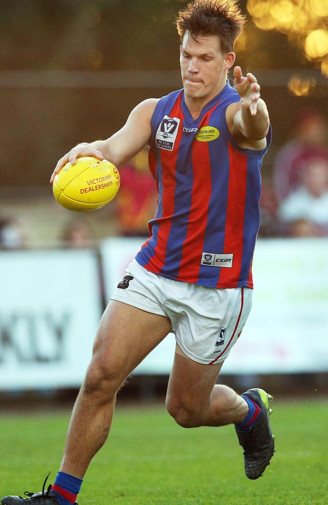 Isaac Conway thumps Port Melbourne forward.