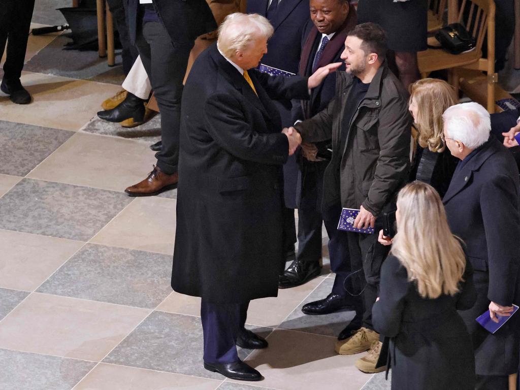 Donald Trump shakes hands with Volodymyr Zelensky at the re-opening of Notre Dame cathedral last December. Picture: AFP