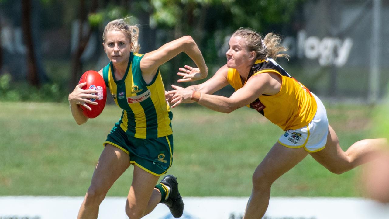 PINT's Katie Streader in typical pose, running hard with the ball. Picture: Aaron Black AFLNT/Media