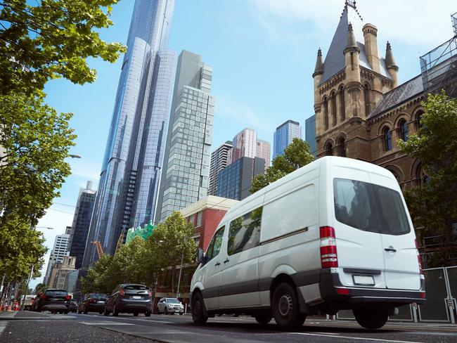 Delivery white van in the city street