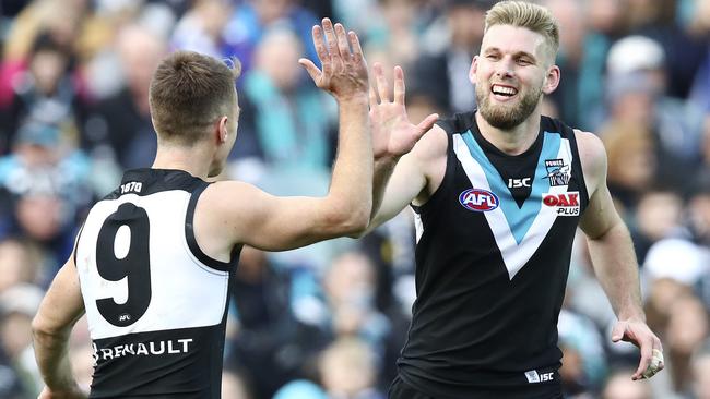 Port Adelaide’s Jackson Trengove celebrates his goal with Robbie Gray. Picture: SARAH REED