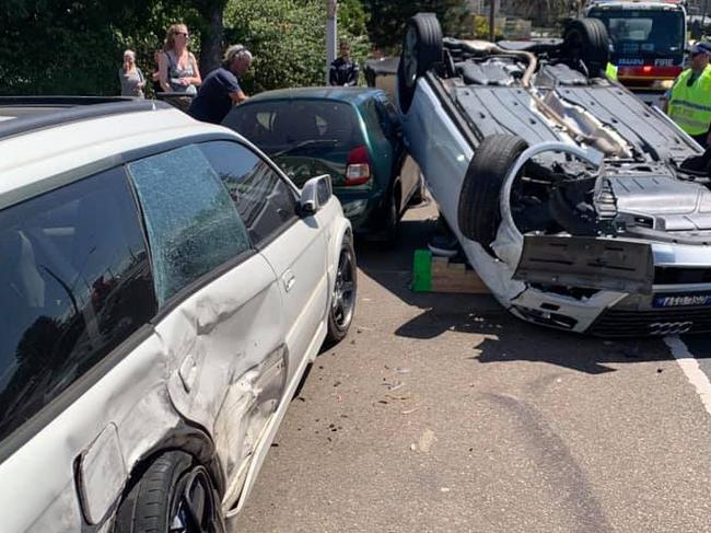 A man was injured when his car flipped on Barrenjoey Rd, Avalon Beach, and struck two parked cars. Picture: Facebook