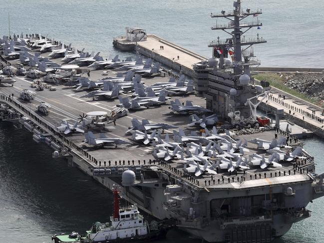 The aircraft carrier USS Ronald Reagan (CVN 76) is escorted into Busan port, South Korea, after completing a joint drill with the South Korean military, Saturday, Oct. 21, 2017. U.S. naval commanders on Saturday reiterated Washington's 