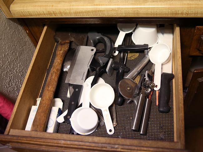 A hatchet sits in a kitchen drawer inside the home of shooting suspect Syed Farook. Picture: Getty