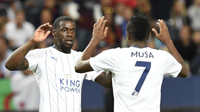 Ahmed Musa (R) celebrates with his teammate Jeff Schlupp after scoring a goal.