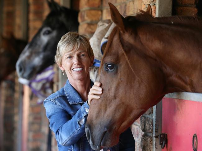 Racehorse trainer Gillian Heinrich believes she has beaten cancer. She said it was "like winning Lotto". Giliian welcomed back to her stables at Bundall by a couple of two year olds. Picture Glenn Hampson