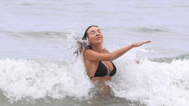 She was snapped getting hit by a wave. Picture: MediaMode.com