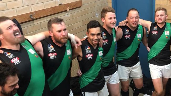 Greenacres players sing the song after a drought-breaking victory in the Adelaide Footy League. Credit: Matt Osborn