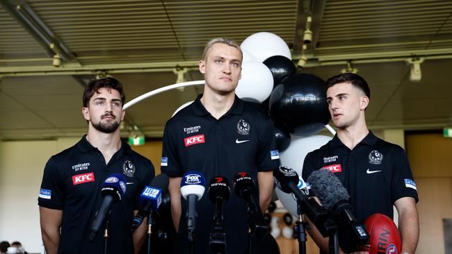 The Daicos brothers and Moore at a press conference in grand final week. Picture: Getty Images