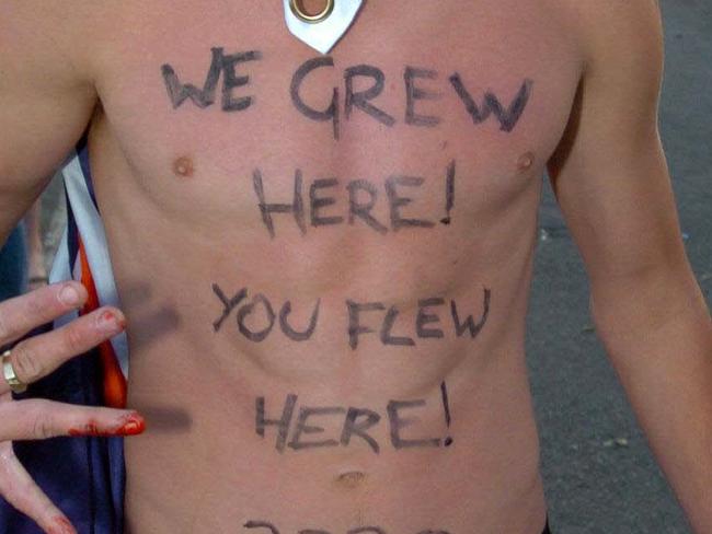 Australian youth Ryan (no surname) with message daubed on his chest 'We Grew Here, You Flew Here' during racial riot with Middle Eastern youths at Cronulla in Sydney's south.