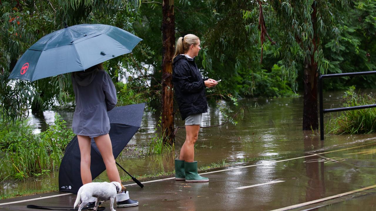 Kate Dukes, 45, on the right, chose not to evacuate as the Nepean River flooded. Picture: NCA NewsWire / Gaye Gerard