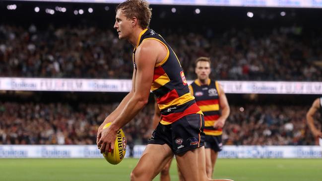 ADELAIDE, AUSTRALIA - APRIL 01: Jordan Dawson of the Crows lines up to kick the winning goal during the 2022 AFL Round 03 match between the Adelaide Crows and the Port Adelaide Power at Adelaide Oval on April 01, 2022 In Adelaide, Australia. (Photo by Sarah Reed/AFL Photos via Getty Images)