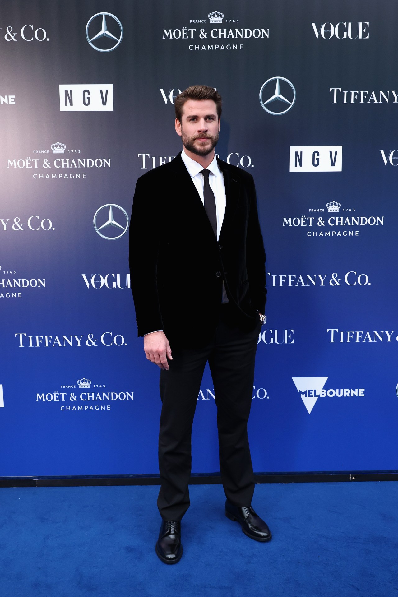 <p>Liam Hemsworth wearing Giorgio Armani.</p>