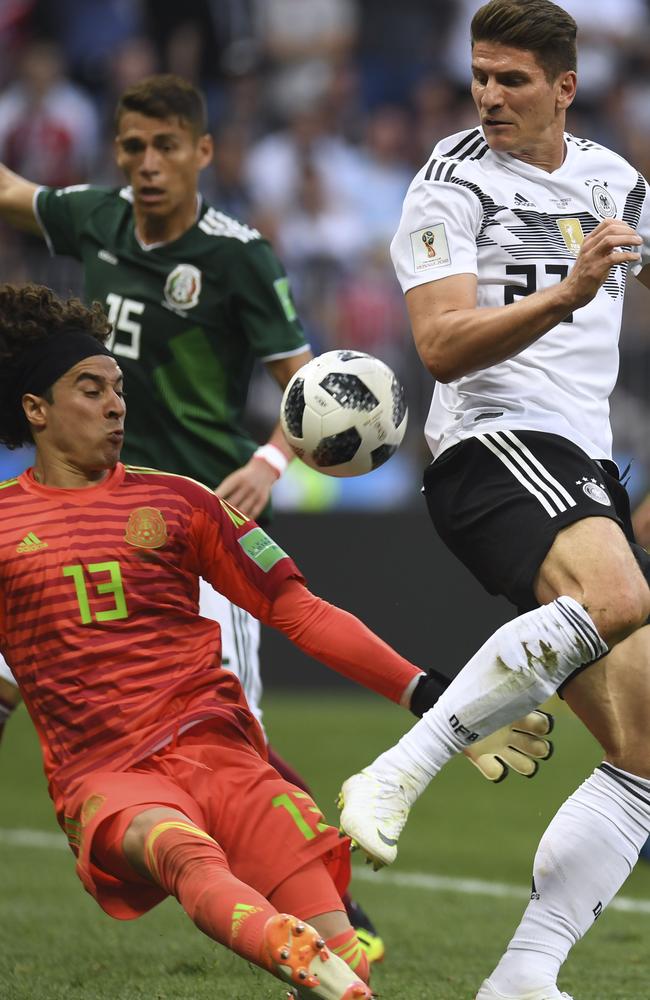 Guillermo Ochoa denies Mario Gomez. Picture: AFP.