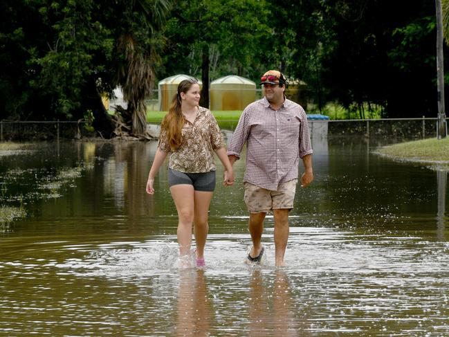 Sunday  February 9. Heavy rain causes flooding in North Queensland. Mahala Thorn and Ryan Maustoukas in Brooke Street, Giru. Picture: Evan Morgan