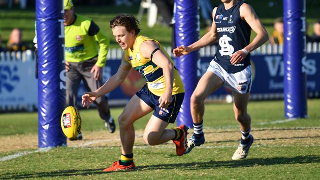 James Rowe gathers the ball in the pocket for Woodville-West Torrens. Picture: AAP/Keryn Stevens)