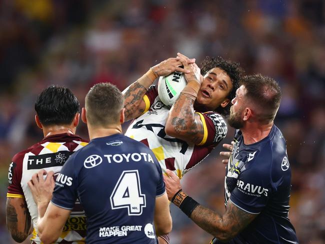 Safe hands. Sailor claims a high ball in the rain on Friday night. Picture: Chris Hyde/Getty Images