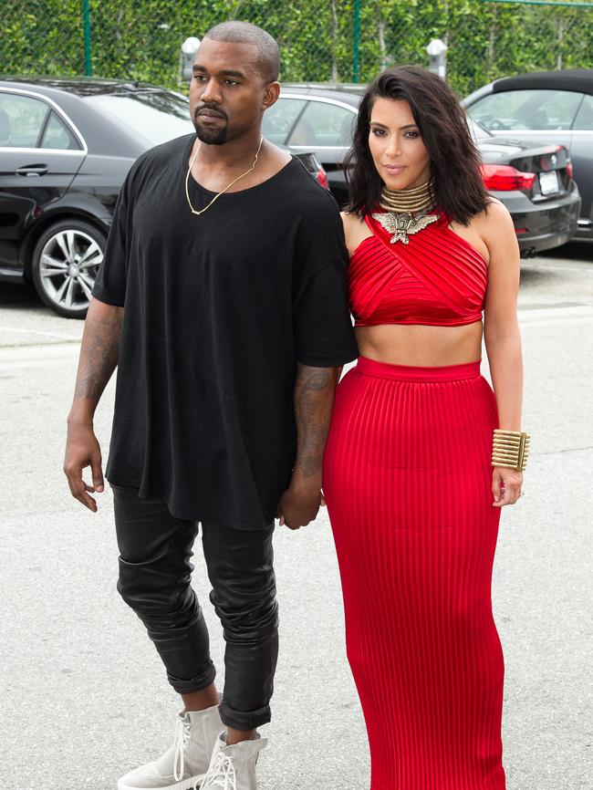 Kanye West and Kim Kardashian arrive on the carpet.