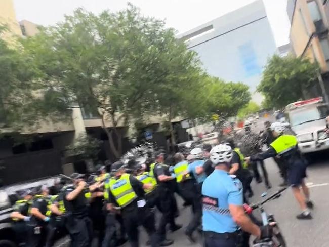 Police confront a group of suspected neo-Nazi at a pro-refugee rally. Picture: TikTok/permanentvisaforrefugees