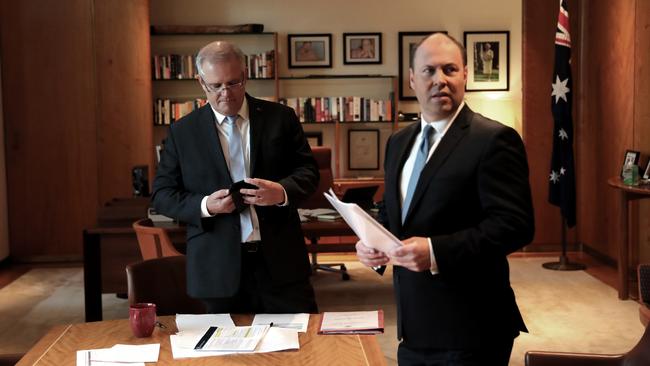 Scott Morrison (left) and Treasurer Josh Frydenberg put the finishing touches on a statement before addressing the media last month. Picture: Adam Taylor/PMO