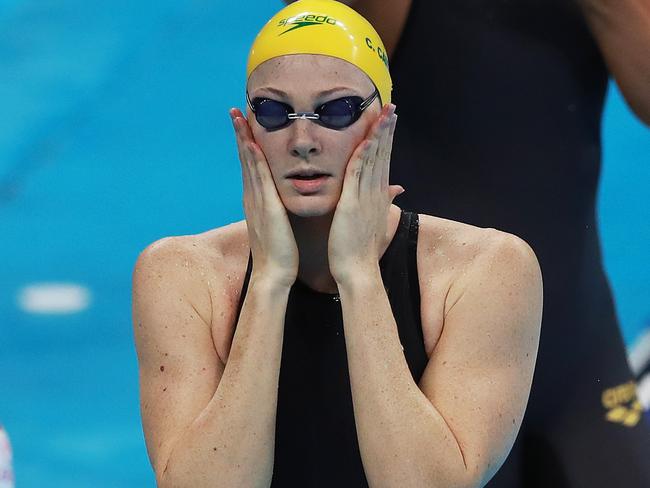 Cate Campbell gives herself a wake up slap ahead of her women's 100m freestyle heat. Picture. Phil Hillyard