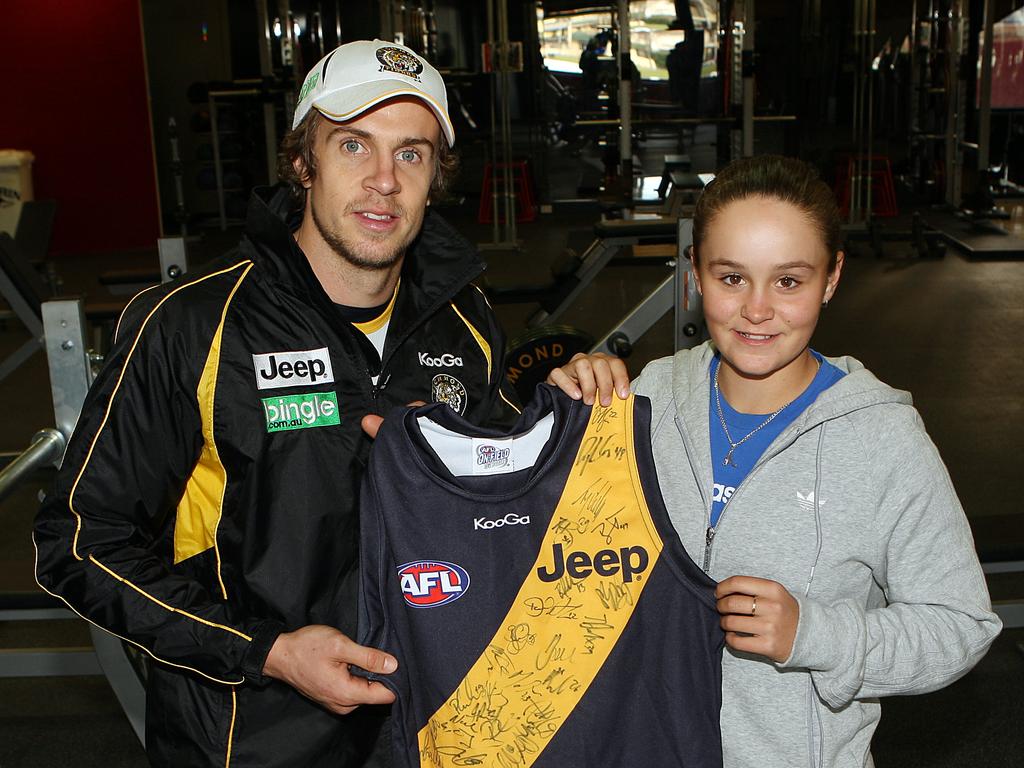 Does Ash love the Tigers more than tennis? A young Barty pictured here with former Richmond star Brett Deledio. Picture: Norm Oorloff/News Limited