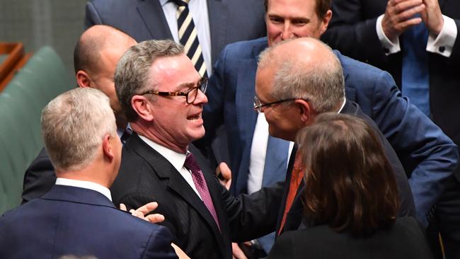 Prime Minister Scott Morrison congratulates Pyne after his valedictory speech in April 2019. Photo: Mick Tsikas / AAP.