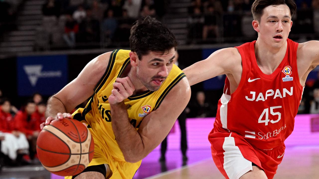 Todd Blanchfield drives past Japan's Kai Toews. Picture: William West/AFP