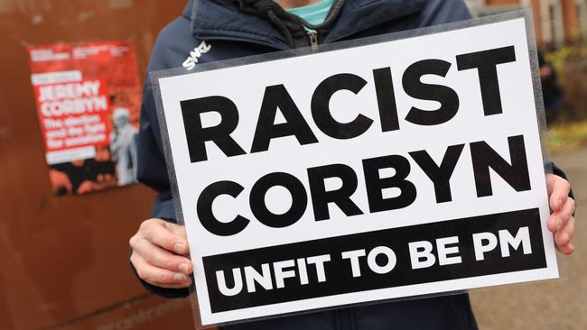 An anti-Labour activist holds a placard in north London. Picture: AFP