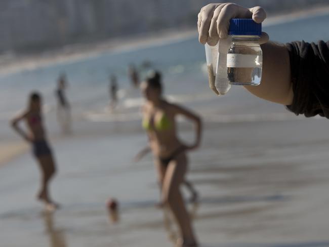 Samples of water and sand from Copacabana Beach, collected for a study commissioned by The Associated Press.