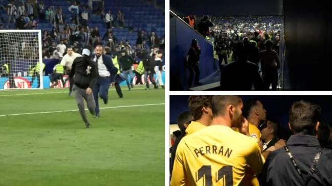 Barca forced into tunnel by rival fans in wild pitch invasion