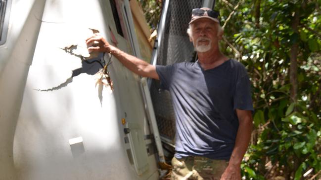 Degarra resident Philip Carlton, who has been helping get essential supplies in to the community since the devastating floods on December 17, stands next to a caravan that has been washed away. Picture: Bronwyn Farr