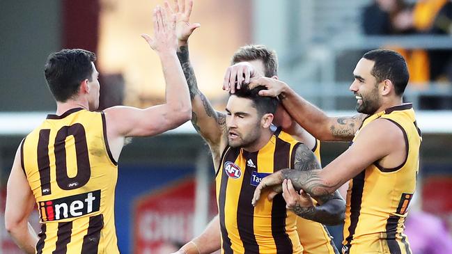 Chad Wingard high fives Jaeger O’Meara after a goal. Picture: Getty Images