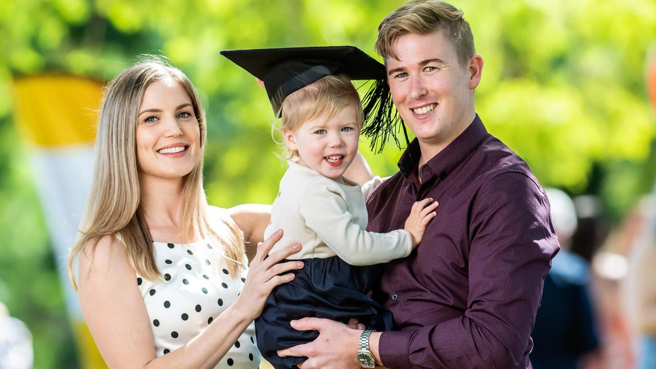 University of Southern Queensland graduates Andrew and Kirsten Beer, pictured with their daughter Audrey, have more in common than most married couples. Picture: David Martinelli (USQ Media Comms).