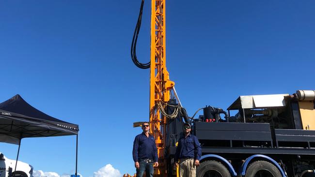 AQUA MEN: Tweed Valley Water Bores director Tim Sewell and assistant Dylan Holden don't want you to spend $700,000 buying a drill rig like their 25 tonne, 10m high machine, when you can hire them to drill down to 300m and find spring water for you. Photo: Alison Paterson