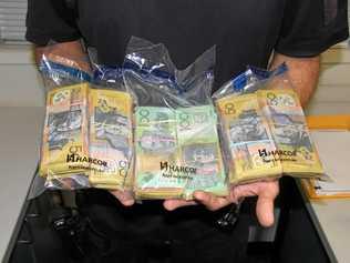 $80,000 cash was found concealed in a car, in a bust led by Sgt Sebastian Pollock. Picture: Roma Road Policing Unit