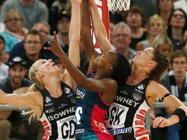 Vixens’ Mwai Kumwenda battles for the ball against Magpies April Brandley and Sharni Layton.