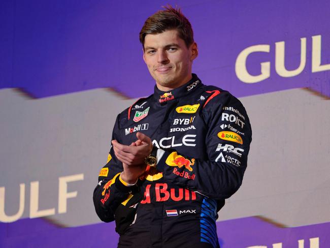 First placed Red Bull Racing's Dutch driver Max Verstappen celebrates during the podium ceremony of the Bahrain Formula One Grand Prix at the Bahrain International Circuit in Sakhir on March 2, 2024. (Photo by Giuseppe CACACE / AFP)