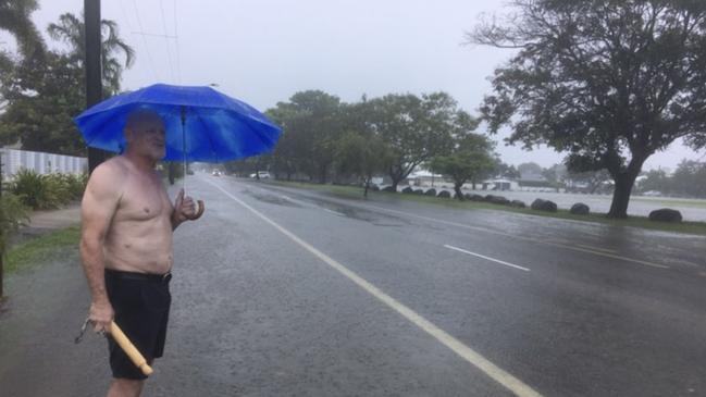 A local resident checks out the flooding in Townsville on Friday, January 31.