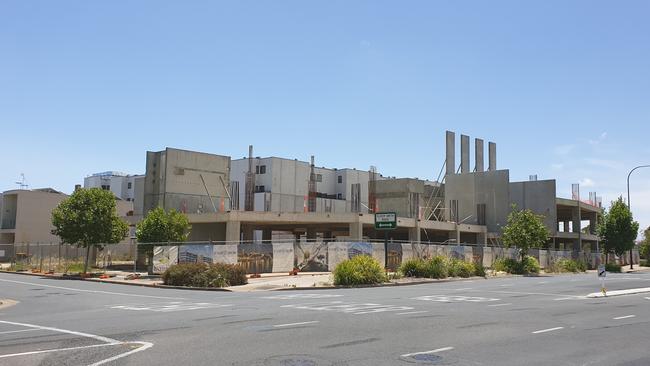 The abandoned Emperor Living apartment development on the corner of Main Street and Metro Parade.