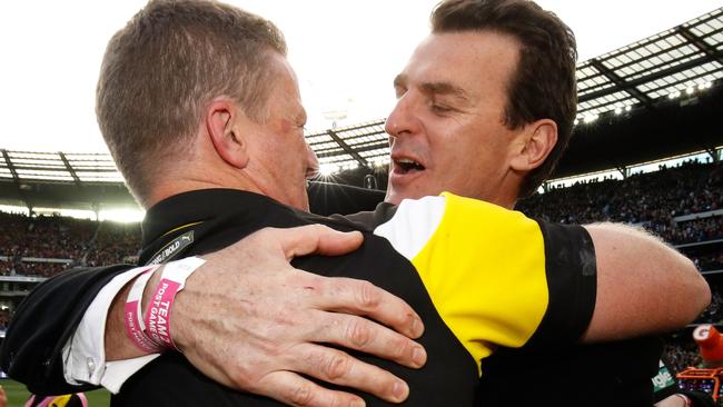 Brendon Gale embraces Damien Hardwick after the Tigers’ premiership.