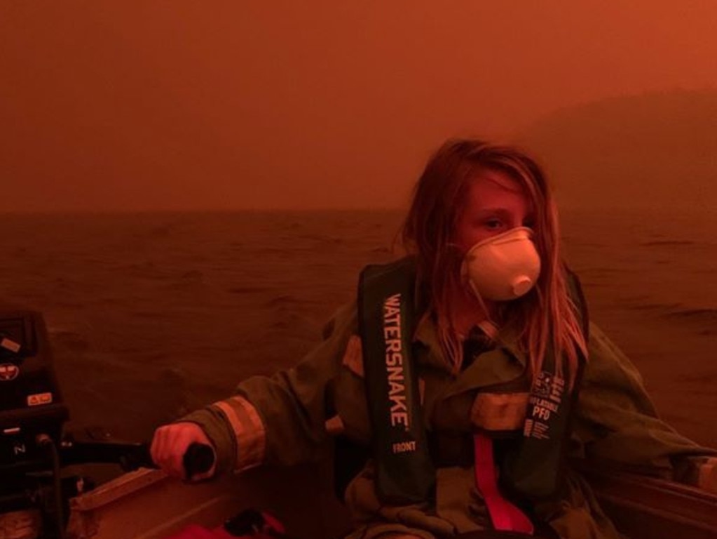 The photograph of Finn driving the boat to safety.