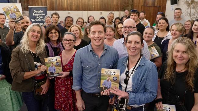 Scott Pape with locals at his book launch, which was followed by a "Beer With Barefoot" advice session, in flood-damaged Lismore.
