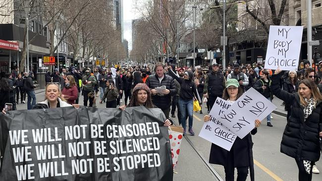 Anti lockdown protesters marching along Swanston Street. Picture: Olivia Jenkins