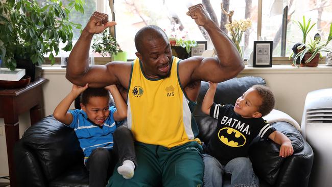 Simplice Ribouem, with sons Nathan and Samuel. He fled the Cameroon team at the Melbourne Commonwealth Games in 2006, received refugee status and now competes for Australia. Picture: Alex Coppel